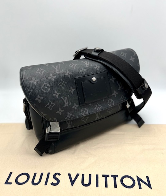 Louis Vuitton Monogram Eclipse PM Voyager Bag.