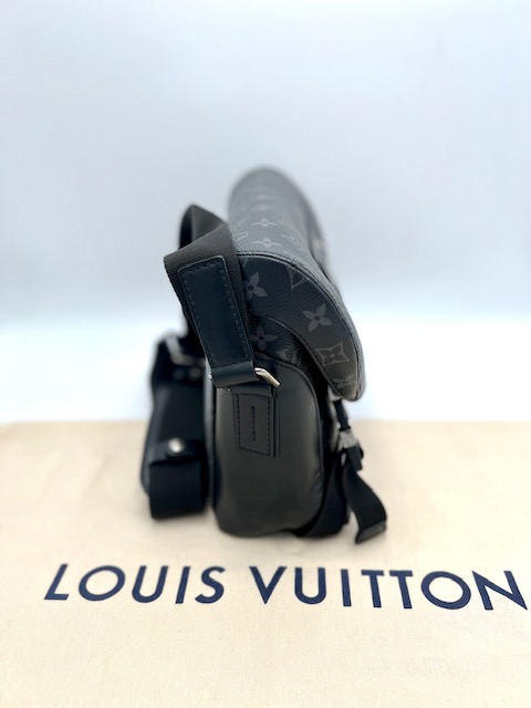 Louis Vuitton Monogram Eclipse PM Voyager Bag.
