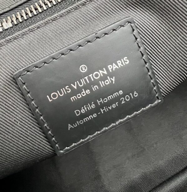 Louis Vuitton Monogram Eclipse PM Voyager Bag.