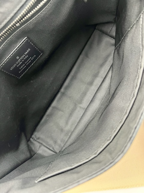 Louis Vuitton Monogram Eclipse PM Voyager Bag.